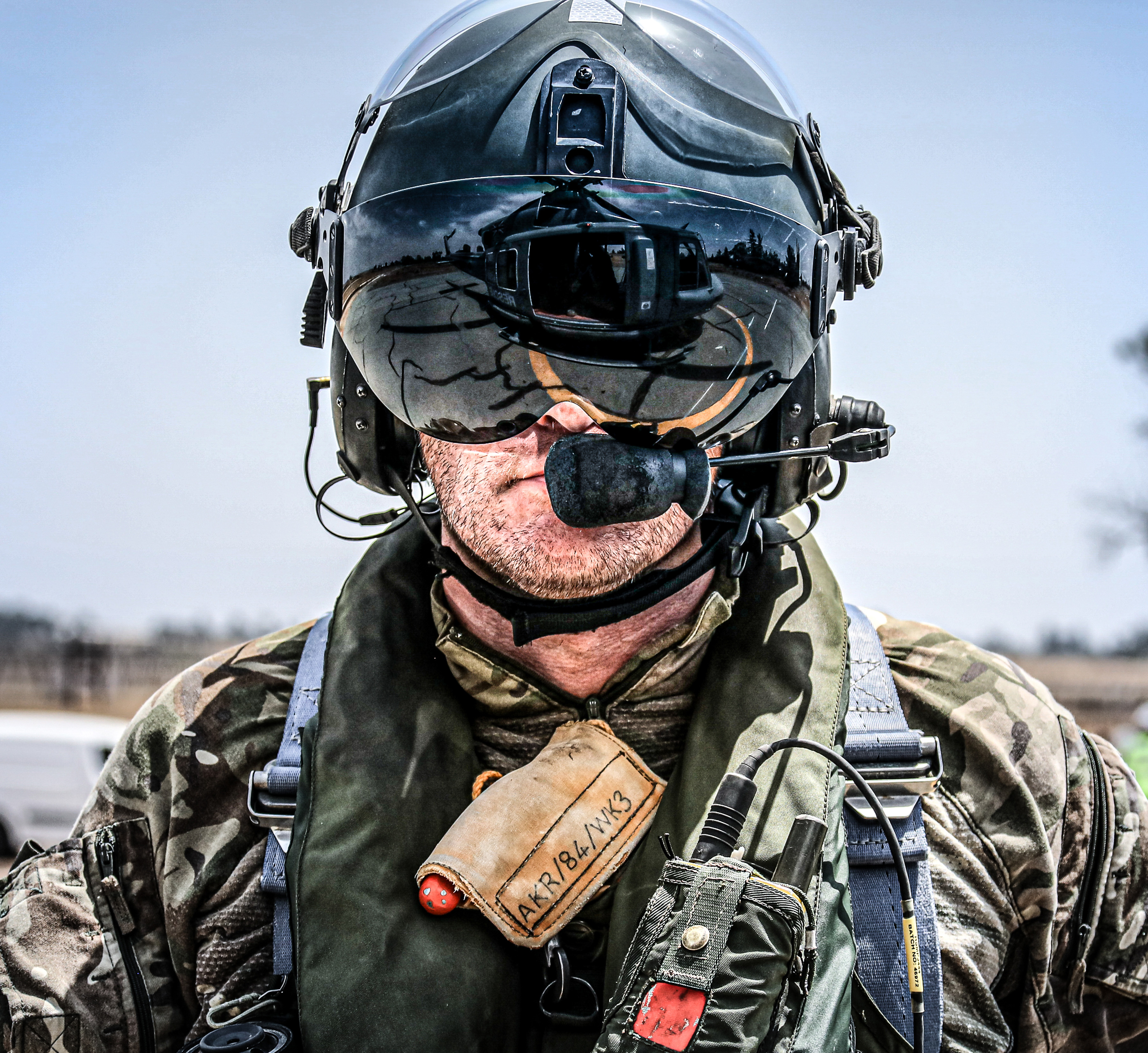 Aviator wears specialist head gear with radio.